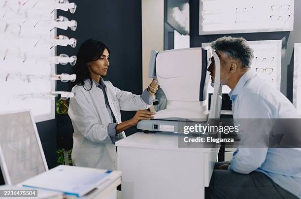 Ophthalmologist examining a patient's eyes before cataract surgery at Vishal Eye Center, Jagadhri