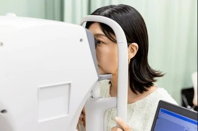Patient undergoing computerised eye testing before LASIK at Vishal Eye Center